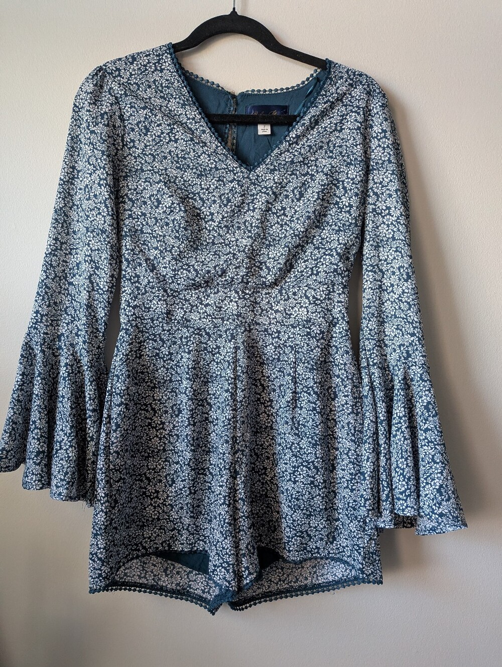 Francesca's Blue Rain Teal Floral V-Neck Romper with Bell Sleeves